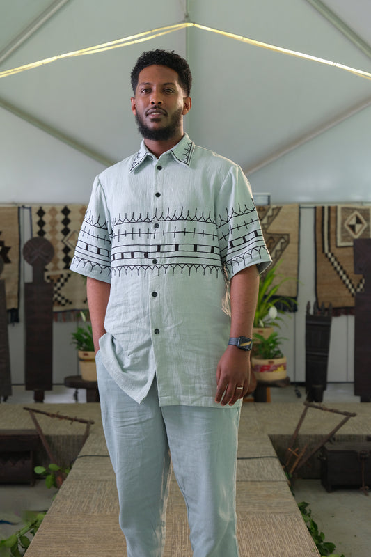 Ethiopian Elegance: Light Blue Habesha Shirt and Trouser Set with Black Embroidery